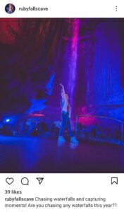Ruby Falls instagram post with blue and pink lighting