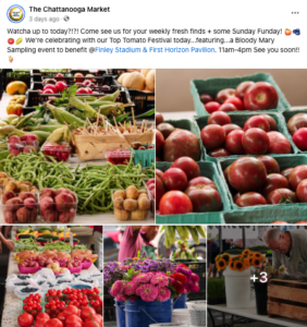 Fresh strawberries, flowers, corn on the cob and other produce is shown at an outdoor market.