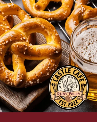 Several giant soft pretzels and a craft beer on a table 